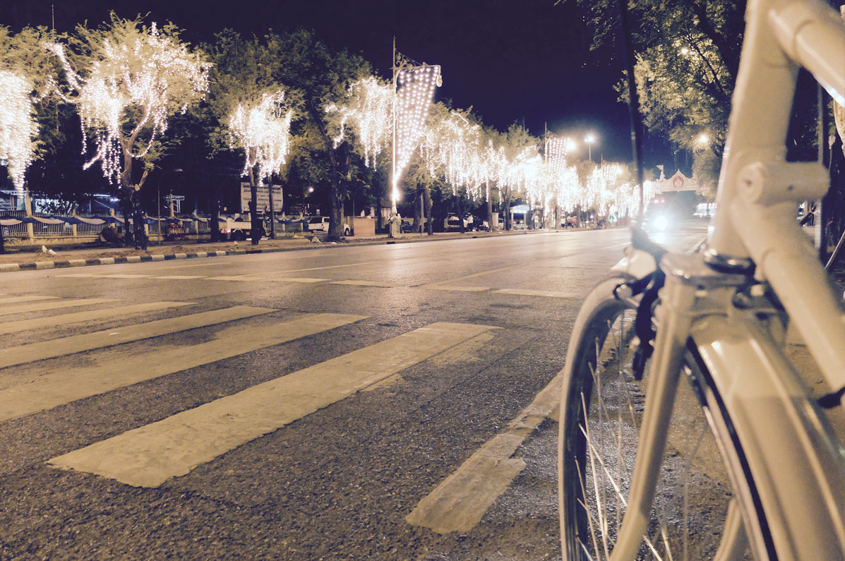 Cycling in avenue with lights